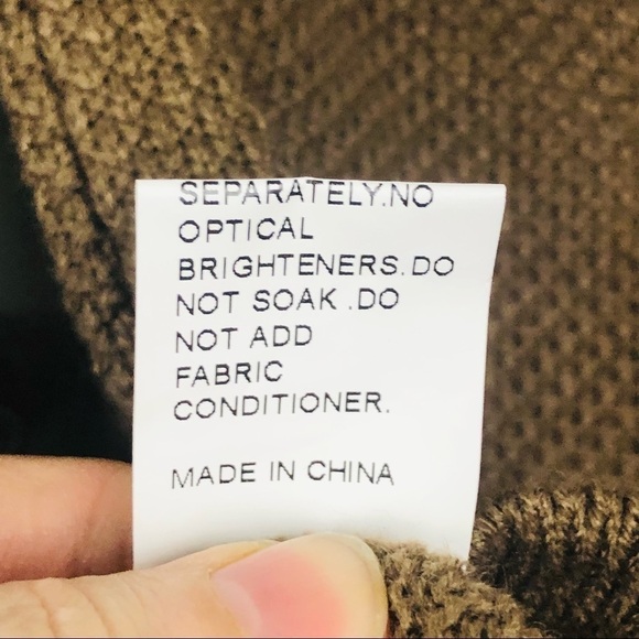 Brown net turtleneck sweater with cold shoulder and fringe cuffs - Picture 15 of 15